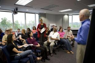 Man speaking in front of a group of people